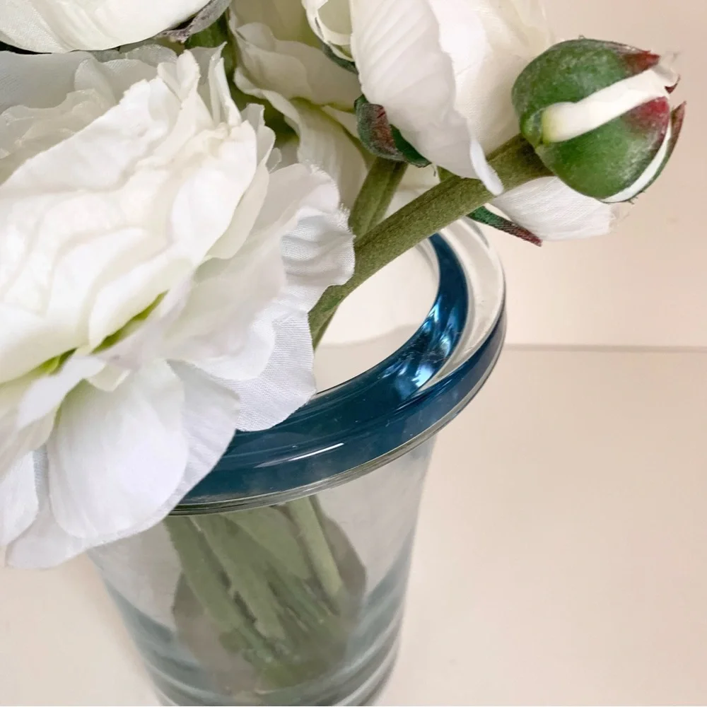 Thomas O’Brien Faux flowers in blue glass vase